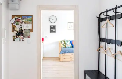 a hallway with a door leading to a bedroom at Cosy Apartment 2 in Kraków