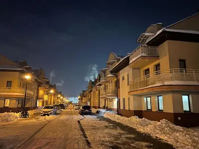 a building with a parking meter in front of it at Apartament Raffi in Kraków