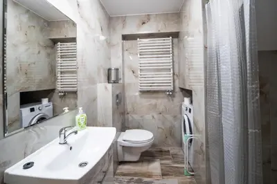 a bathroom with a toilet and a sink and a shower at Michalka 1 - Domki pod Leskowcem in Targoszów