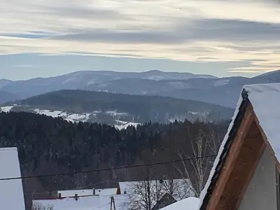 a view of a ski slope in the mountains at Michalka 1 - Domki pod Leskowcem in Targoszów