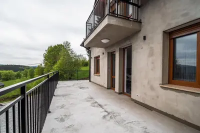 an empty balcony of a house with a view at Michalka 2 - Domki pod Leskowcem in Targoszów