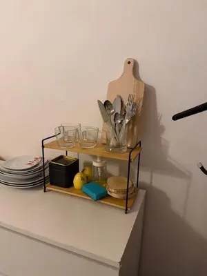 a shelf with plates and glasses on a wall at Ojców, Na Widoku in Ojców