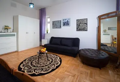 a living room with a couch and a table at Cozy Apartament Rachel-Near Rynek Netflix in Kraków