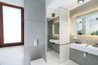 a bathroom with two sinks and a mirror at Ekskluzywny Apartament Garden Residence *Basen/Siłownia* in Kraków