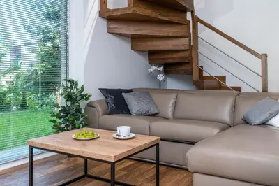 a white room with two beds and a window at Prestigious Residence with Garden, Garage, and Elegant Rooms in Kraków