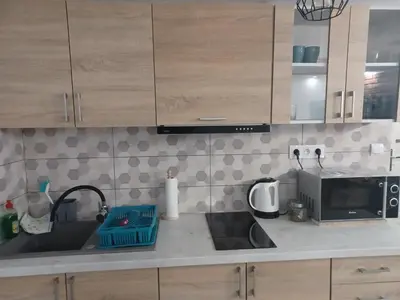 a kitchen with a sink and a microwave at Studio Familly-nocleg-Zator- Wadowice-Oświęcim-Kraków in Bachowice
