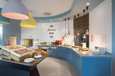 a rendering of a hotel building at Hampton by Hilton Krakow Airport in Balice