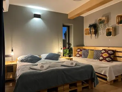 a bedroom with two beds with towels on them at H&G Boutique Apartments in Oświęcim