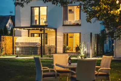 a table and chairs in front of a house at H&G Boutique Apartments in Oświęcim