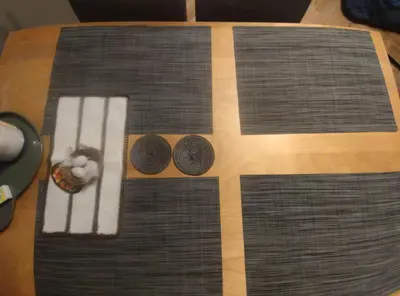 a wooden table with two bowls on top of it at u cioci Lutki urocze mieszkanie z balkonem in Kraków