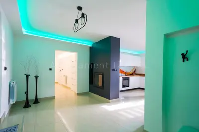 a living room with a bike hanging from a ceiling at Apartament Izabel in Nowy Targ