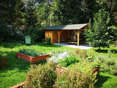 a gazebo in the middle of a garden at Slow Life Rabka in Rabka
