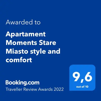 a blue sign that says upgraded to apartment monuments state massico style and comfort at Apartament Moments Stare Miasto Style and Comfort Netflix in Kraków
