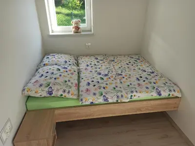 a small bed in a room with a window at Feel like in Heaven in Bachowice
