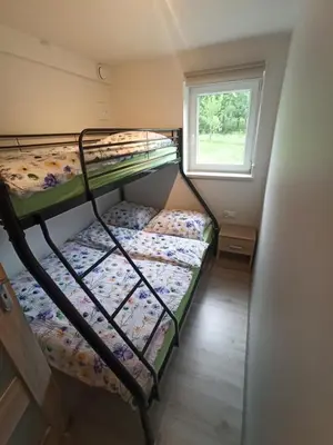 two bunk beds in a small room with a window at Feel like in Heaven in Bachowice