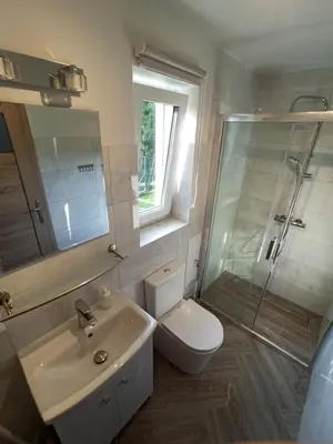 a bathroom with a toilet and a sink and a shower at Feel like in Heaven in Bachowice