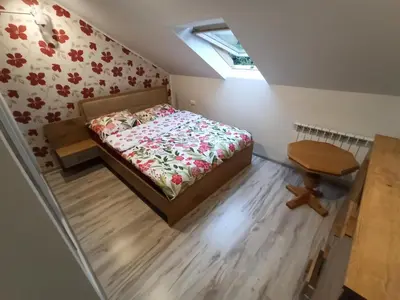 a small bedroom with a bed and a table at Feel like in Heaven in Bachowice