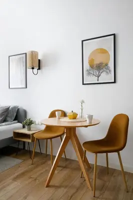 a table and two chairs in a living room at Charming Apartment, Wawel & Old Town Krakow in Kraków
