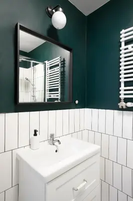 a bathroom with a white sink and a mirror at Charming Apartment, Wawel & Old Town Krakow in Kraków