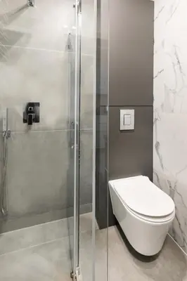 a bathroom with a toilet and a shower at Apartamenty Platinex 5 in Kraków