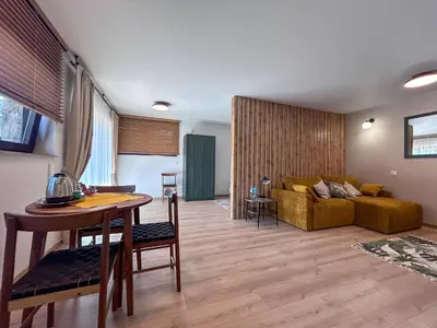 a living room with a couch and a table at ZAGÓRZANKA Pensjonat Rehabilitacyjno-Rekreacyjny SiS Dziadkowiec - Spółka Jawna in Mszana Dolna