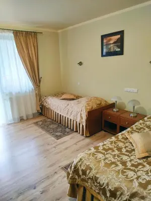 a bedroom with two beds and a window at ZAGÓRZANKA Pensjonat Rehabilitacyjno-Rekreacyjny SiS Dziadkowiec - Spółka Jawna in Mszana Dolna