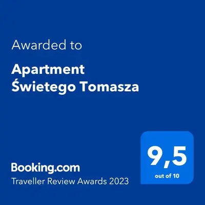 a blue sign with the text awarded to appointment subscribe totnctnctnc at Apartment Świetego Tomasza in Kraków