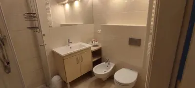 a small bathroom with a toilet and a sink at Apartment Świetego Tomasza in Kraków
