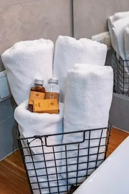 a basket filled with towels and jars of honey at Smart Executive in Kraków