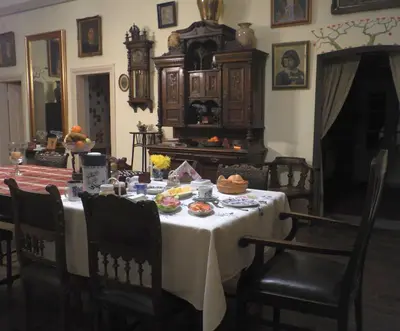 a dining room with a table with food on it at Dwór w Odonowie in Odonów