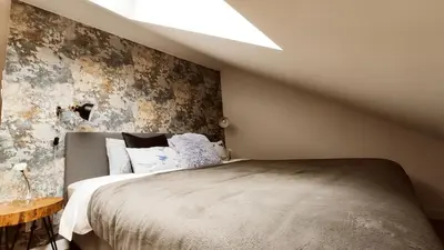 a bedroom with a bed and a ceiling with a light at Zamkowa 9 Apartment with a view on Wawel Castle by Homeprime in Kraków