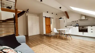a living room with a couch and a table at Zamkowa 9 Apartment with a view on Wawel Castle by Homeprime in Kraków