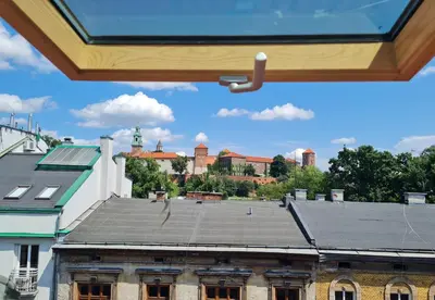 a view of an old building with a roof at Zamkowa 9 Apartment with a view on Wawel Castle by Homeprime in Kraków