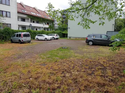 a group of cars parked in a parking lot at 999 Aparthostel in Kraków