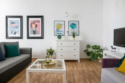 a living room with a couch and a coffee table at Discover Krakow Apartments - 3 Rakowicka St - Classic Apartments near Main Station - Netflix in Kraków