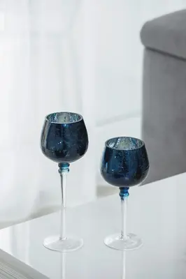 a pair of wine glasses sitting on a table at W Parku Lotników Apartments Tauron Arena by Noclegi Renters in Kraków