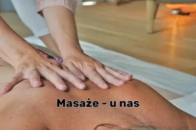 a person getting a massage on a persons knee at Miodowy Raj in Targanice