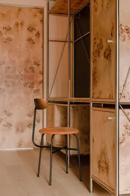 a bedroom with a bed with a lamp on a table at Warszauer Hotel in Kraków