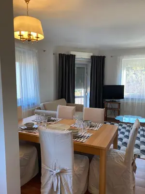 a dining room with a table with wine glasses on it at Let’s Dream Apartment 68 m2 in Kraków