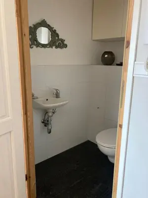 a bathroom with a sink and a toilet at Let’s Dream Apartment 68 m2 in Kraków