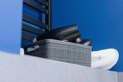 a black office phone sitting on top of a desk at Riva Verona Apartment by Renters Prestige in Kraków