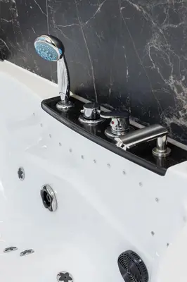 a bathroom sink with a faucet on top of it at Kazimierz Studio with Jacuzzi by Renters Prestige in Kraków
