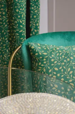 a green chair with a pillow and a table at Kazimierz Studio with Jacuzzi by Renters Prestige in Kraków