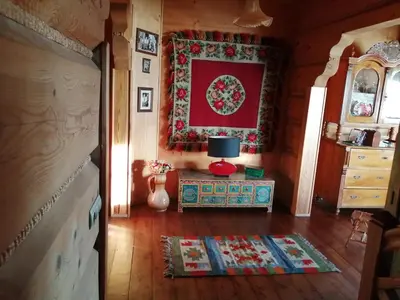a room with a table and a rug on the floor at Góralska Ostoja in Pcim