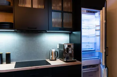 a kitchen with an open refrigerator with a coffee maker at Large 75 m2 Apartment for 6 guests next to Wawel Castle in Kraków