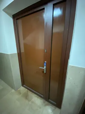 a bedroom with a bed with two night stands at City Apartment Getta in Kraków