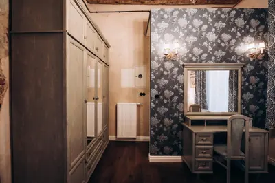 a dressing room with a vanity and a mirror at Native Apartments Dunajewskiego 2 in Kraków