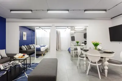 a living room with a couch and a table at Family Center Apartments in Kraków