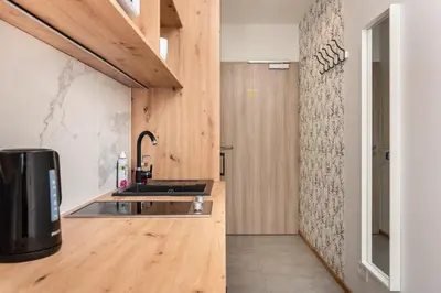 a kitchen with a sink and a counter at Apartamenty na Dębnikach - by Upstairs in Kraków