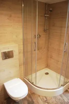 a bathroom with a shower and a toilet at Stay in the Heart of Kraków in Kraków